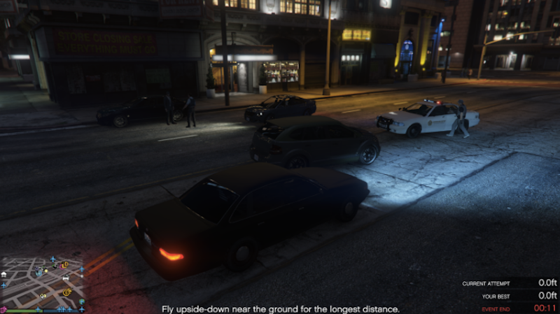 Police stopping a suspected drunk driver. Across the street a man yells at the police on the scene.